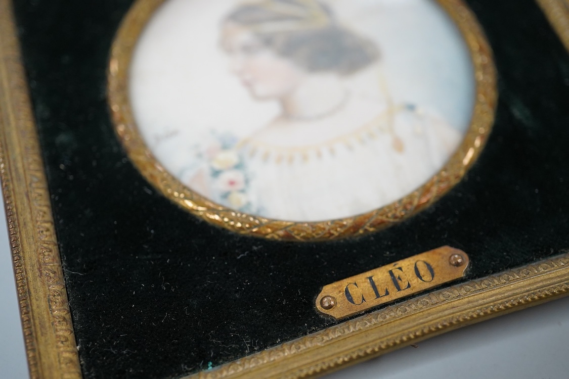 Drea, early 20th century School, Portrait miniature ‘Cleo’, Pre-Raphaelite style, tondo watercolour on ivory, signed, housed in an ornate gilt metal frame, overall 11cm high - CITES Submission reference KB82XPEQ
